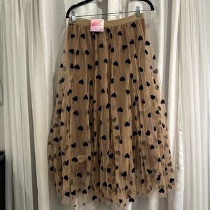 Tan skirt with black hearts